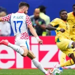 Croatia players celebrate Nikola Vlašić's late winning goal against Ghana as England also sealed qualification from Group L.