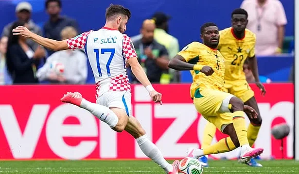 Croatia players celebrate Nikola Vlašić's late winning goal against Ghana as England also sealed qualification from Group L.