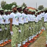 NYSC corps members during orientation camp parade in Nigeria.