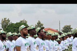 NYSC corps members during orientation camp parade in Nigeria.