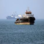 A cargo vessel transits the Strait of Hormuz amid heightened regional security tensions.