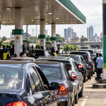 Nigerian motorists queue at a petrol station amid rising fuel prices and economic hardship.