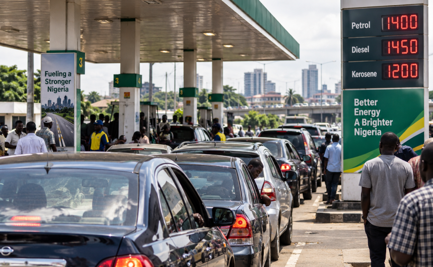 Nigerian motorists queue at a petrol station amid rising fuel prices and economic hardship.