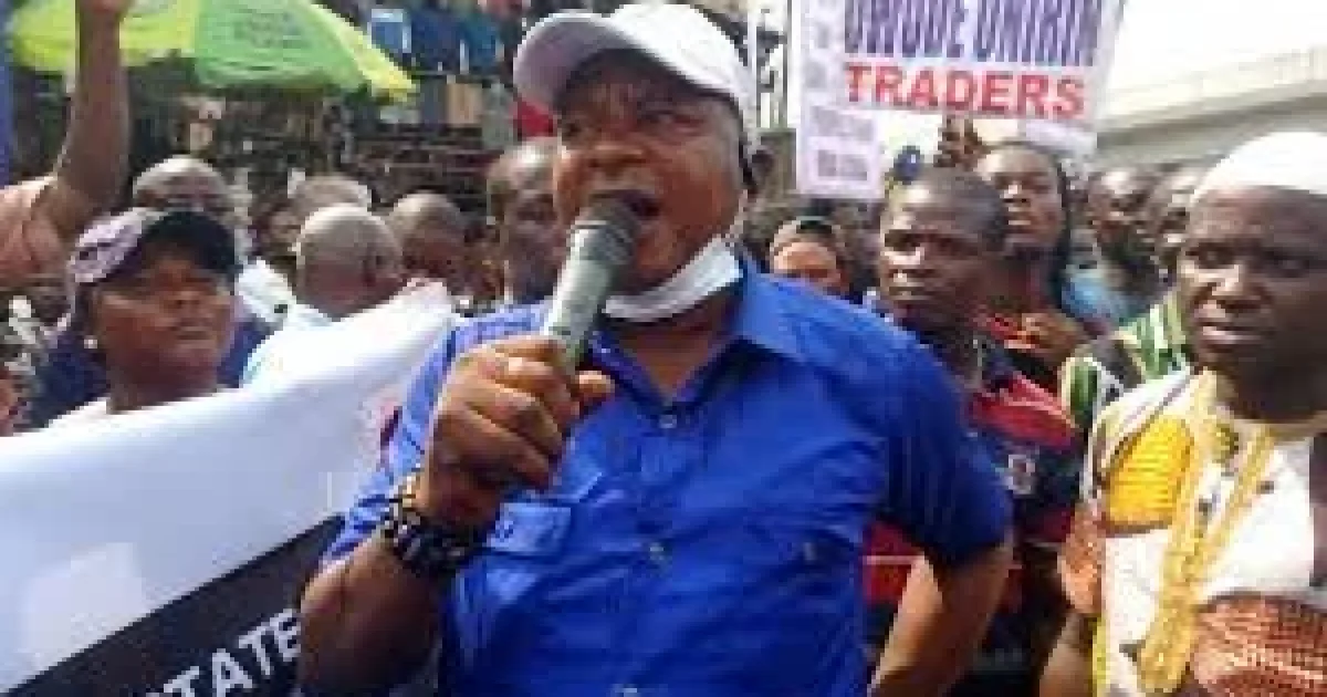 Police officers fire tear gas at residents protesting forced evictions near the Lagos State House of Assembly.