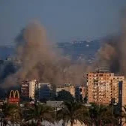 Smoke rises after Israeli airstrikes hit a highway near Beirut airport road in Lebanon during escalating regional tensions.
