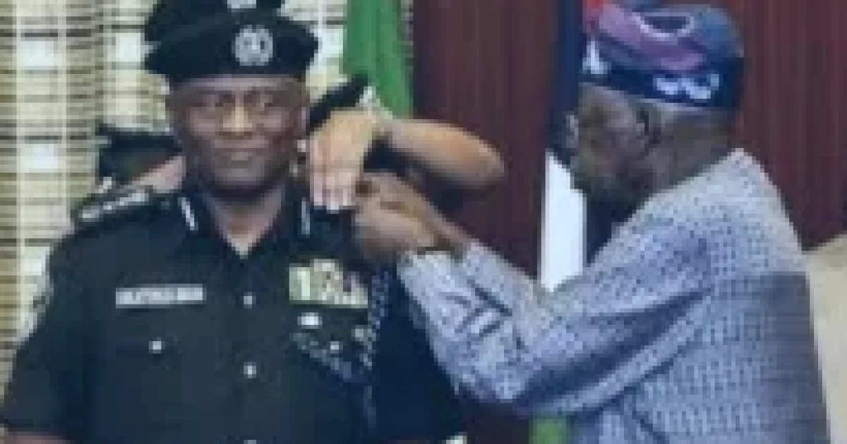 President Tinubu decorating his tribesman, Tunde Disu as acting IGP